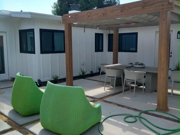 Construction Project by DCB Construction Sacramento Outdoor patio with a wooden pergola with a shade on top in Sacramento CA
